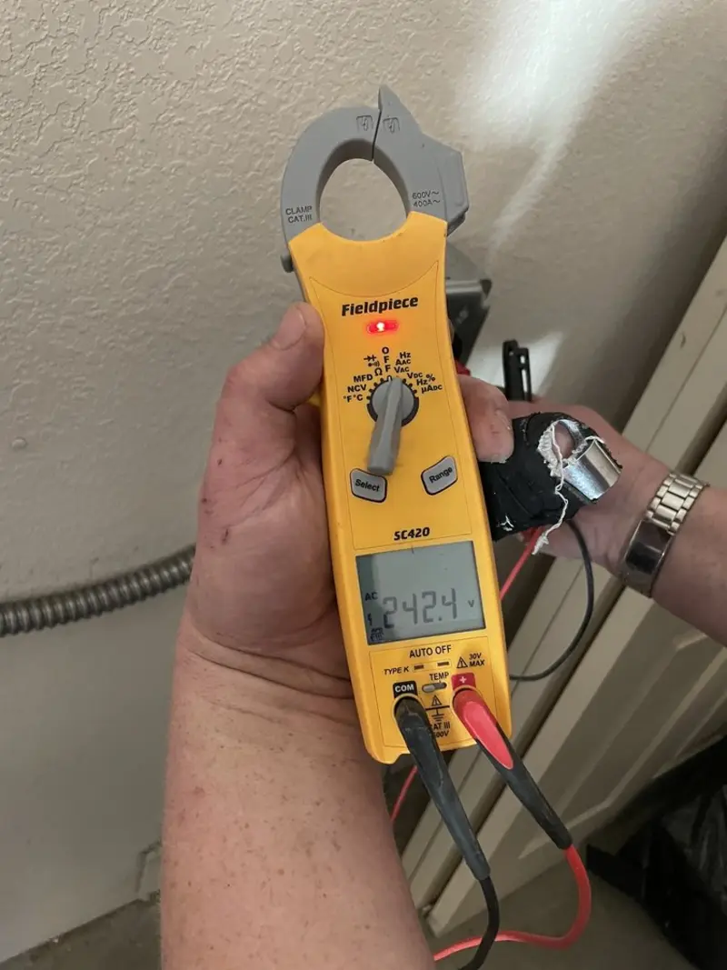 Voltage testing with clamp meter during Ceiling Fan Installation in Olive Branch
